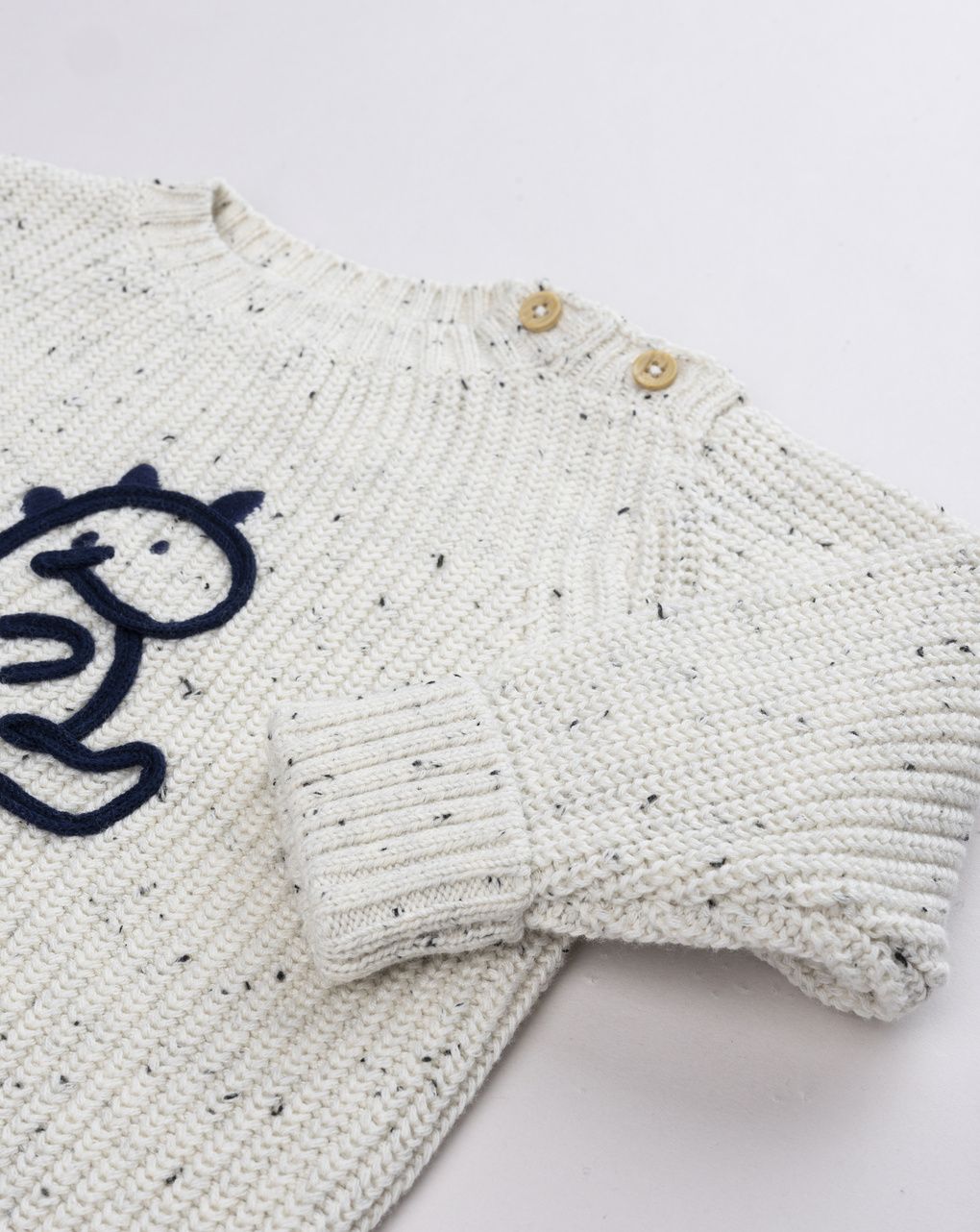 Maglia tricot neonato con dinosauro