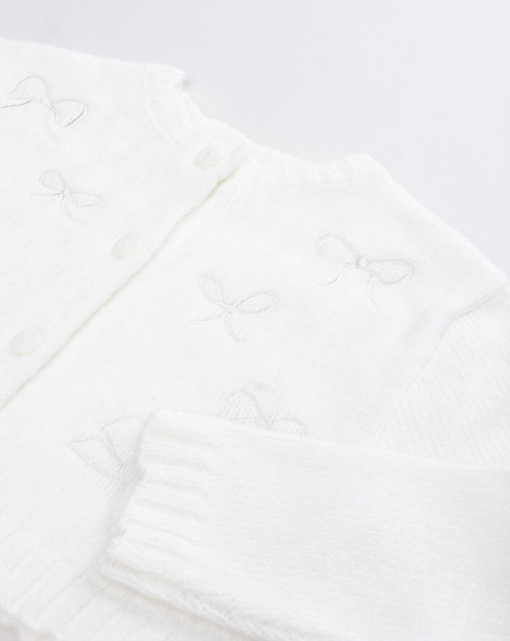 Cardigan bianco bimba con fiocchi intarsiati