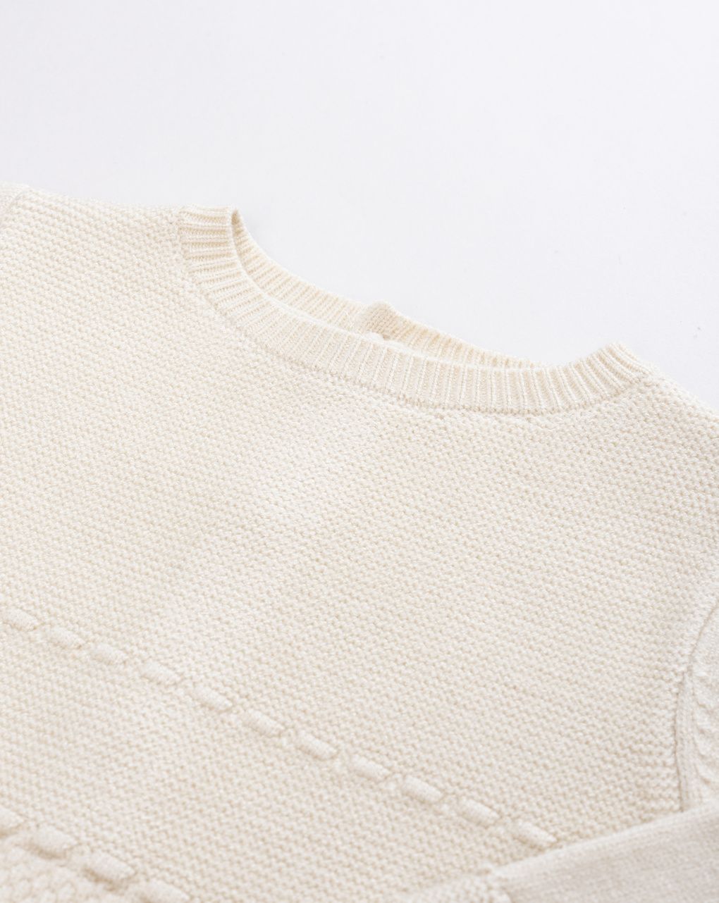 Tutina tricot da neonato beige in maglieria morbida