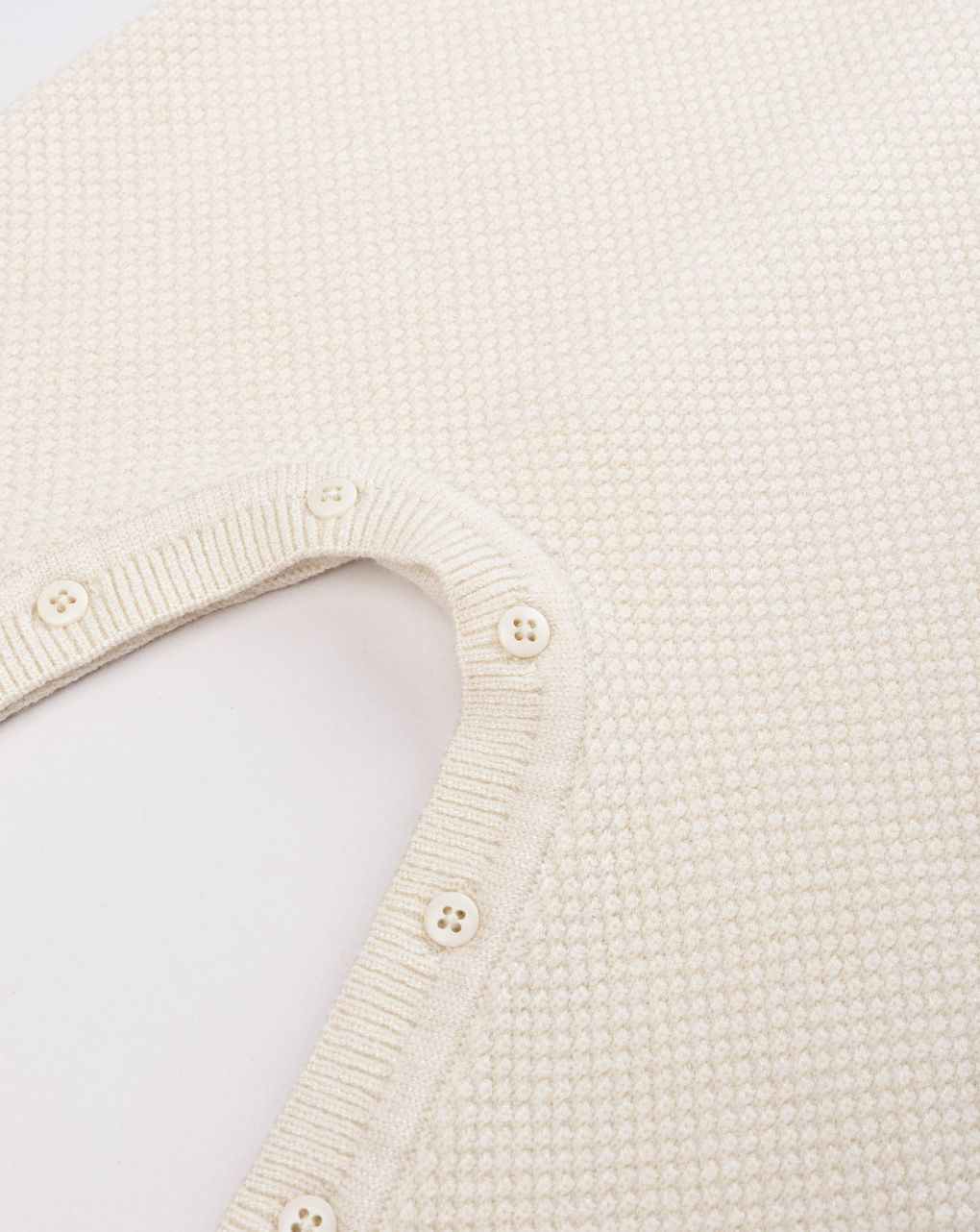 Tutina tricot da neonato beige in maglieria morbida