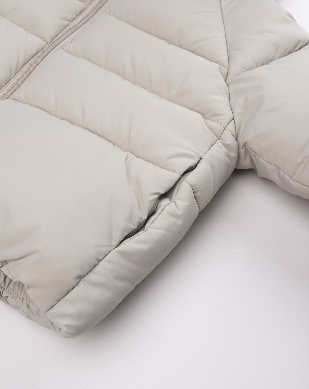 Piumino con cappuccio a orecchie beige bimbo