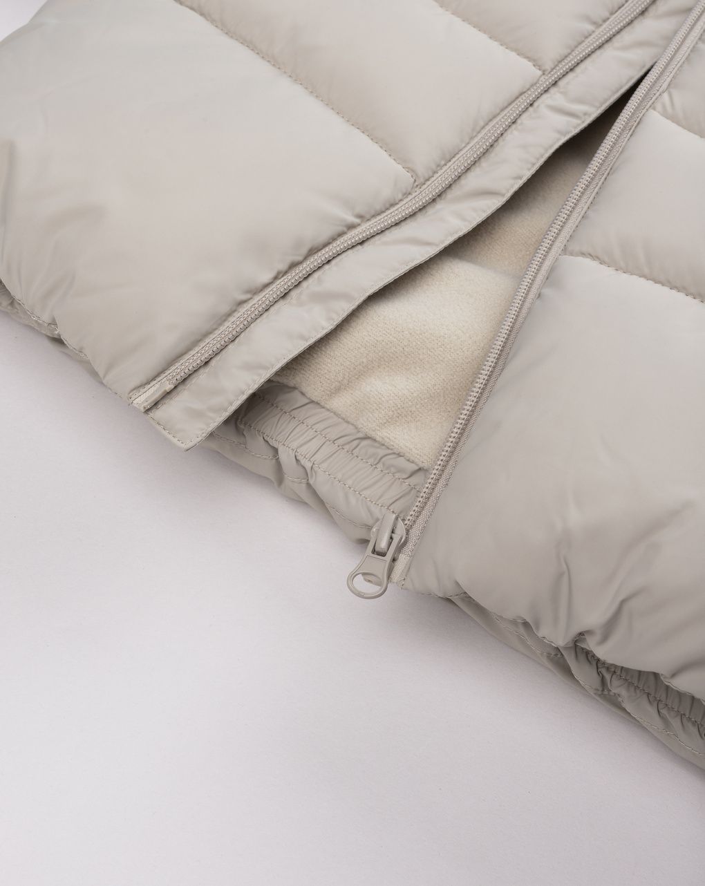 Piumino con cappuccio a orecchie beige bimbo